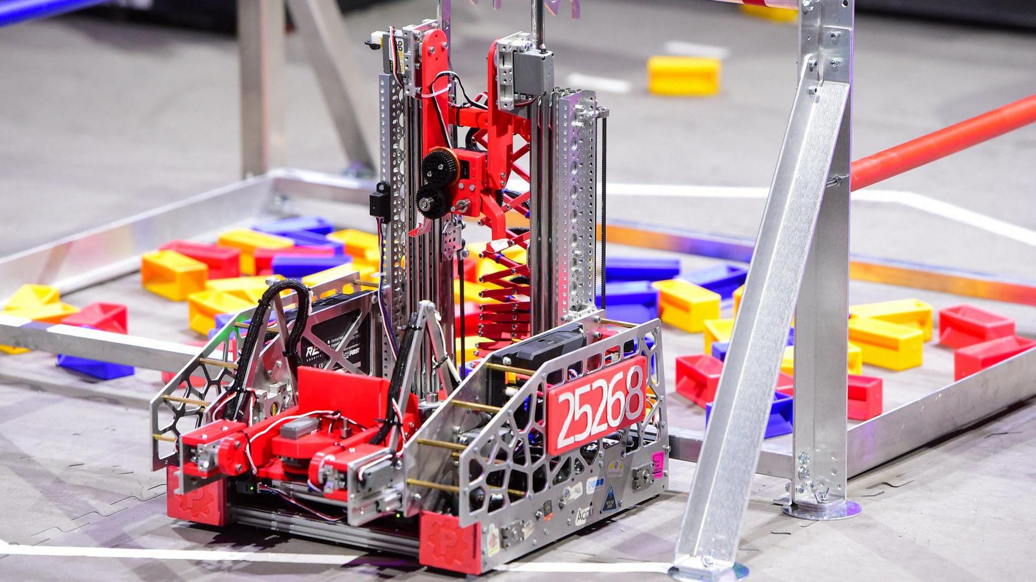   A red and silver steel robot.