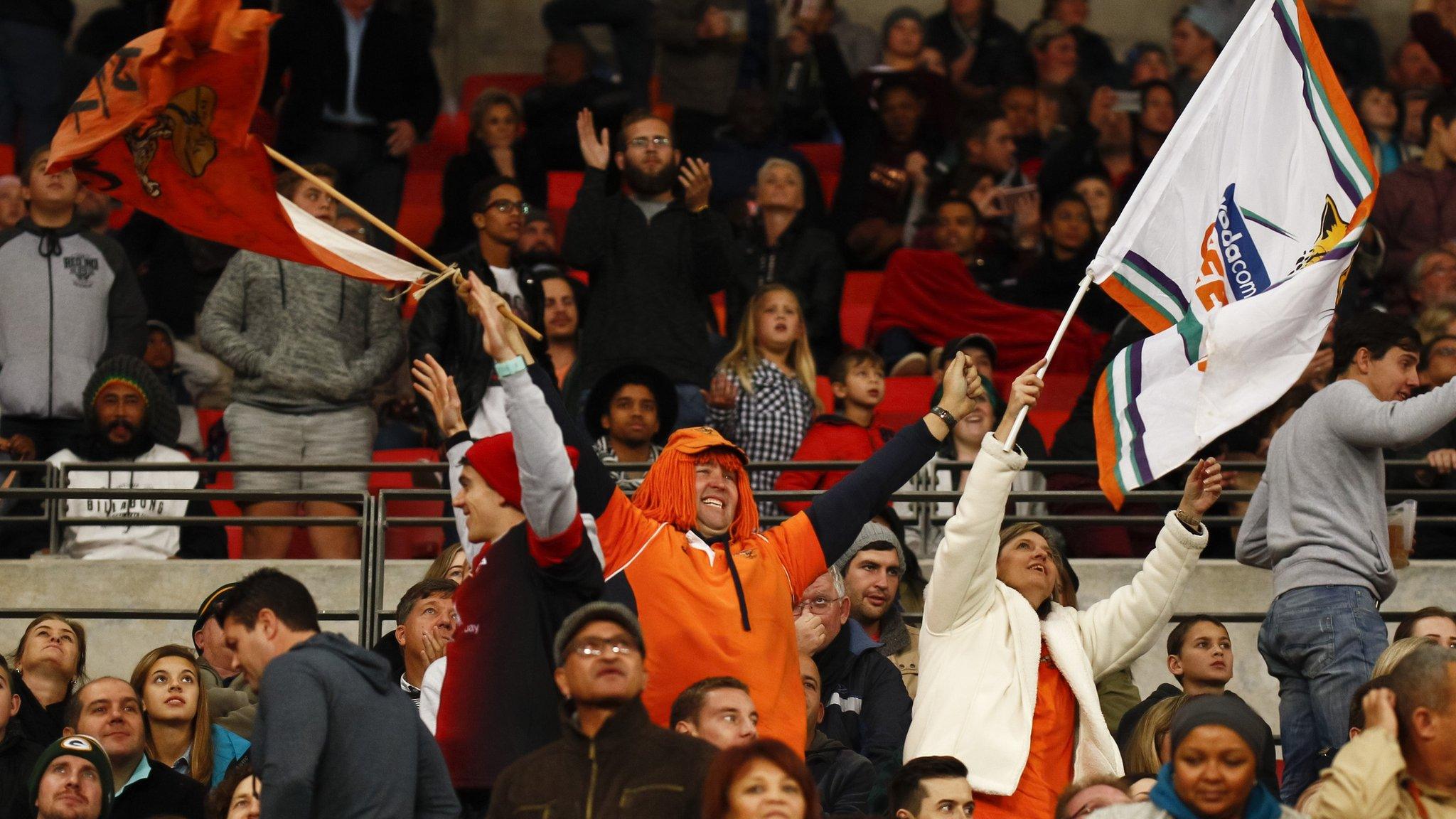 Southern Kings and Cheetahs fans wave banners at their final Super Rugby match