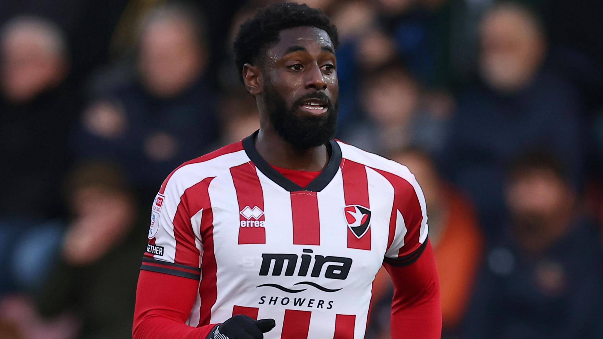 Hakeeb Adelakun in action for Cheltenham Town