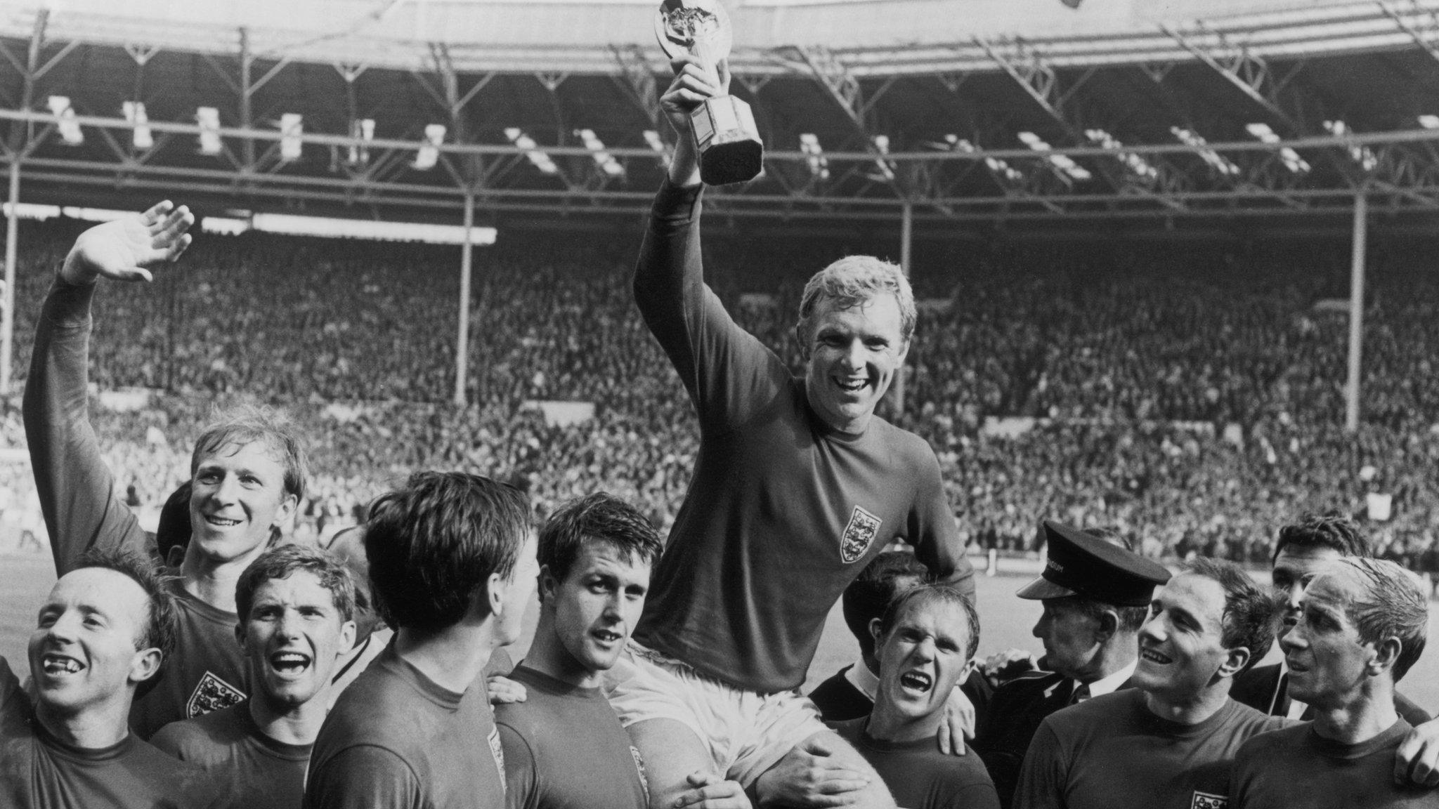 Bobby Moore with the Jules Rimet Trophy and team-mates after England won the 1966 World Cup