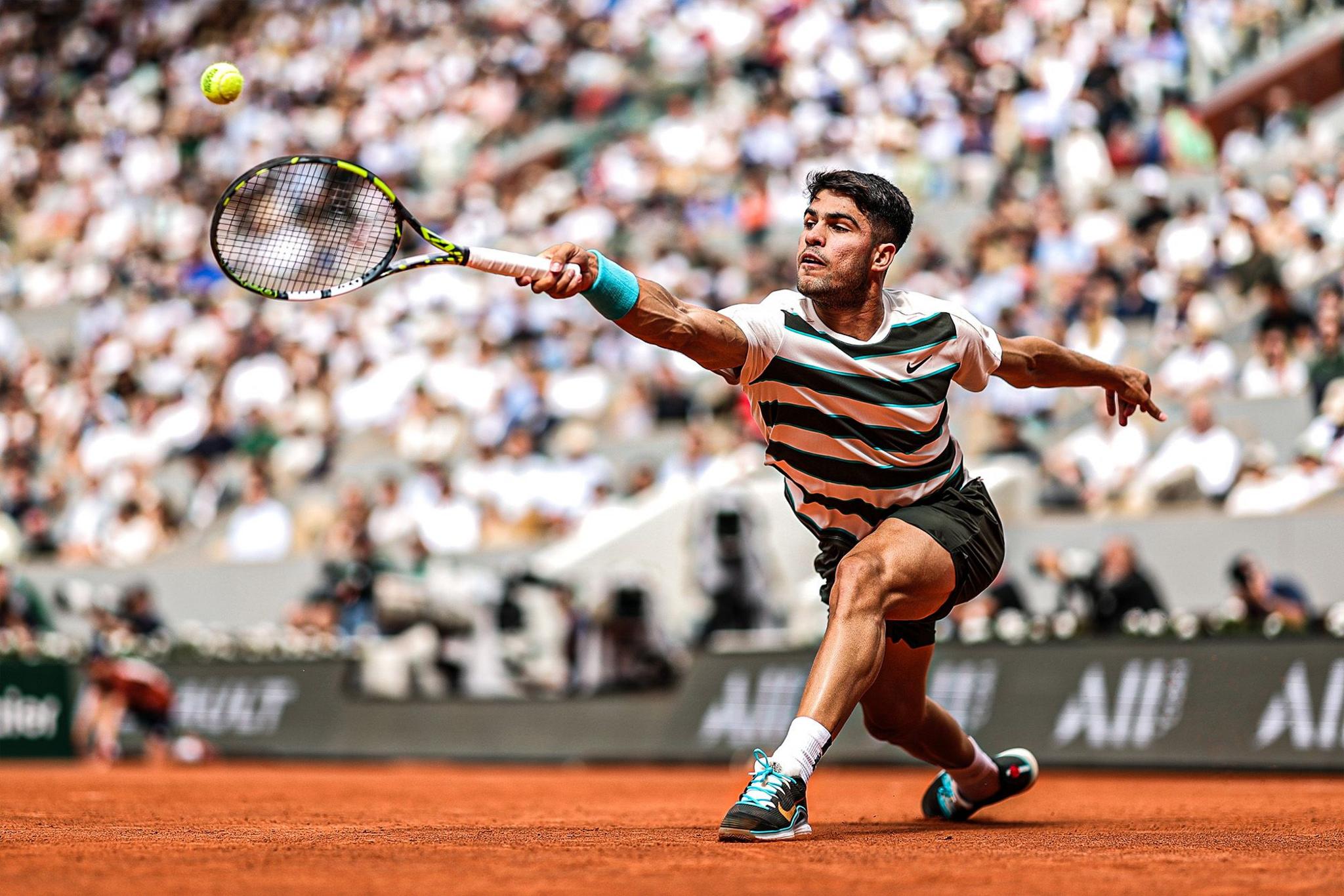 Spain's Carlos Alcaraz plays a backhand against United States' Ben Shelton during the Men's Singles Fourth Round match on Day Eight of the 2025 French Open at Roland Garros in Paris, France. Photo by Julian Finney