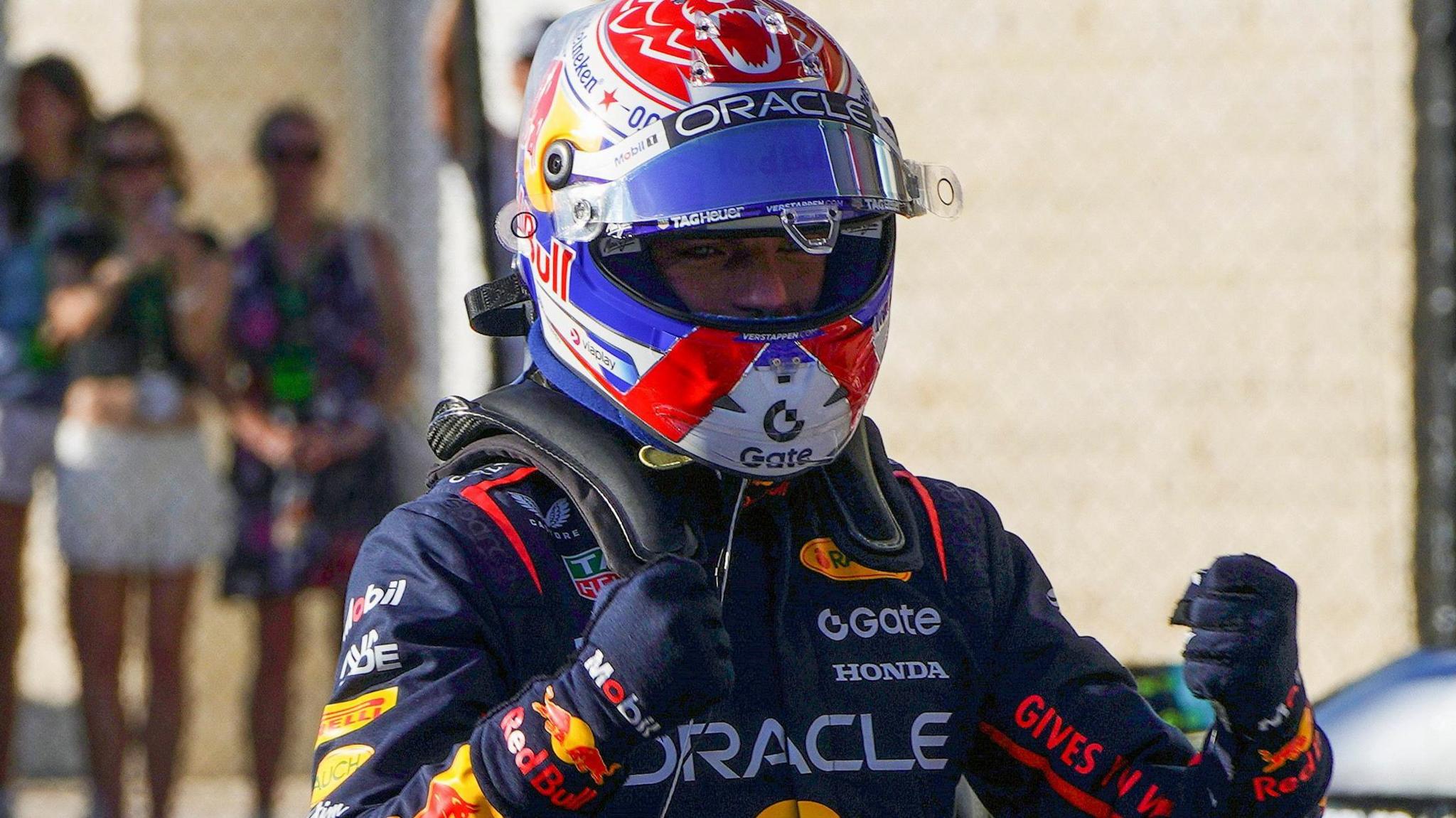 Max Verstappen clenches his fists in celebration after taking pole position for the US Grand Prix