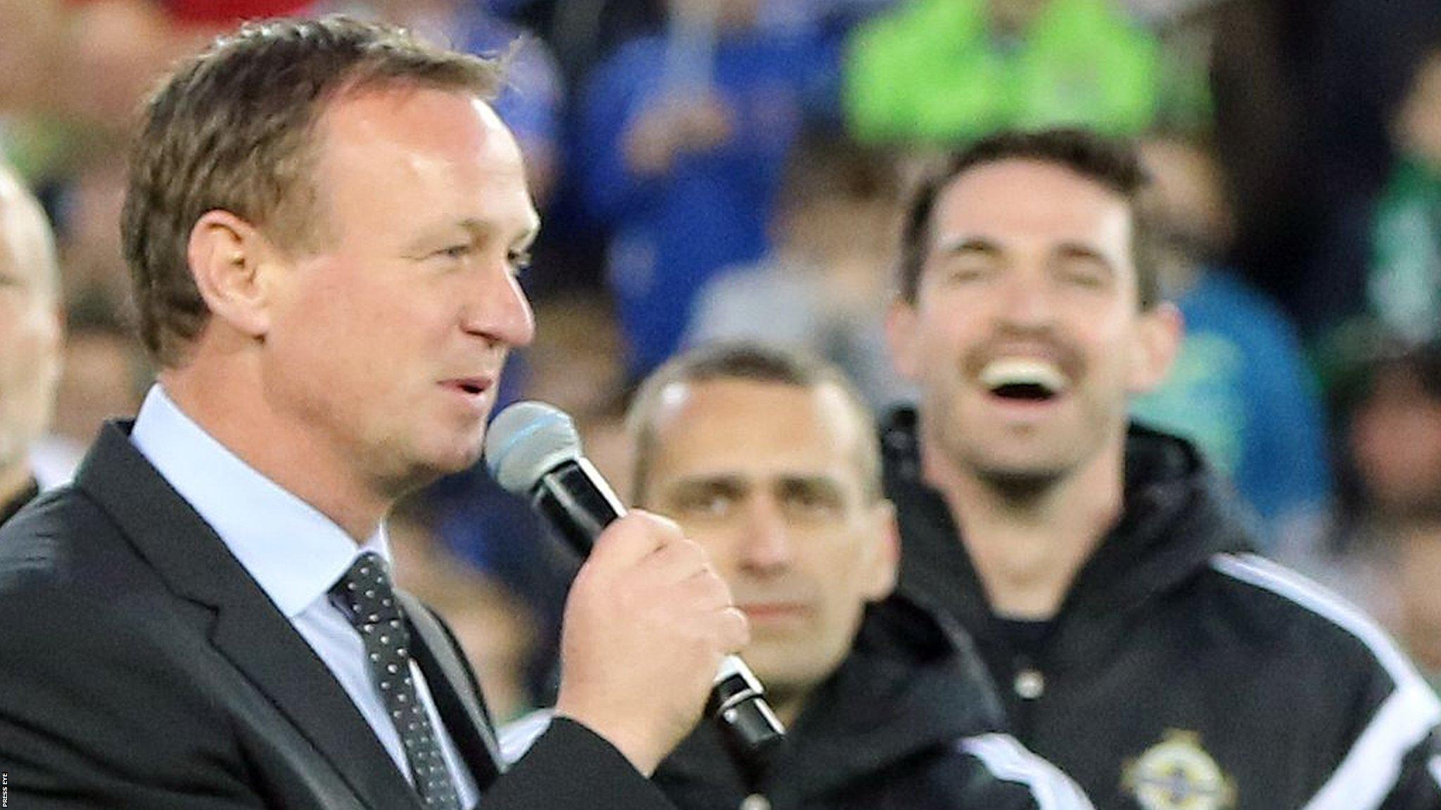 Michael O'Neill addresses the Windsor Park crowd after Northern Ireland's win