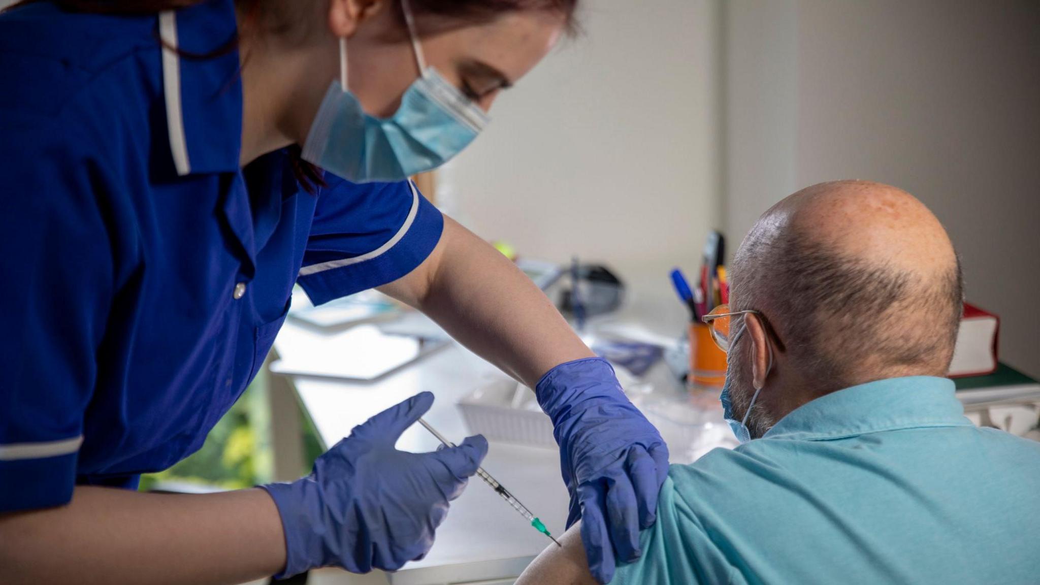 Man receiving Covid vaccination