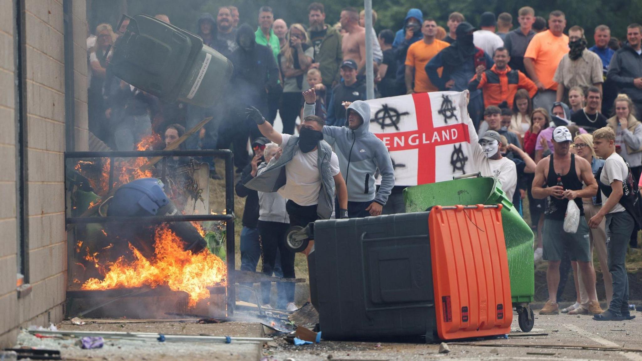 Rioters setting fire to a hotel in Rotherham