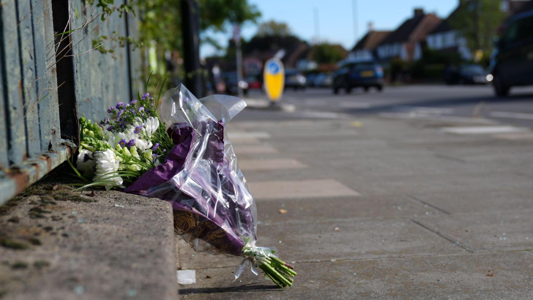 A bunch of flowers left near the scene of the crash