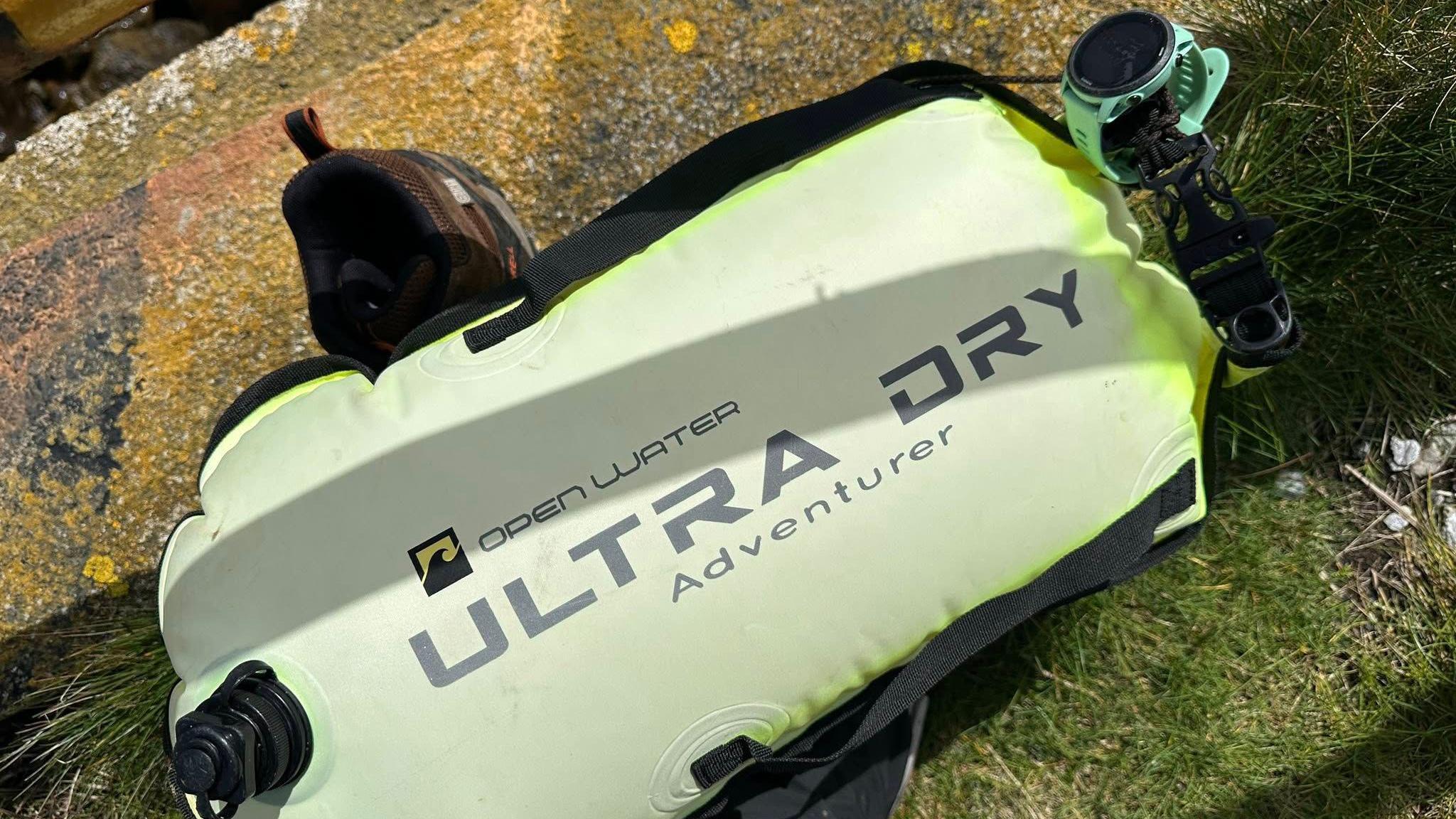 The watched attached to the yellow Open Water Ultra Dry Adventure floating device.