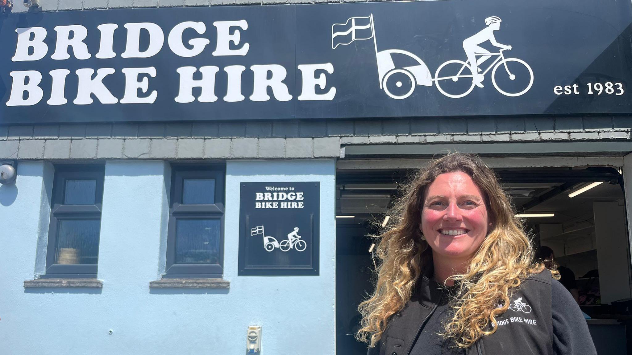 Kelly Arries stands outside the front of her Bridge Bike Hire business in Wadebridge.