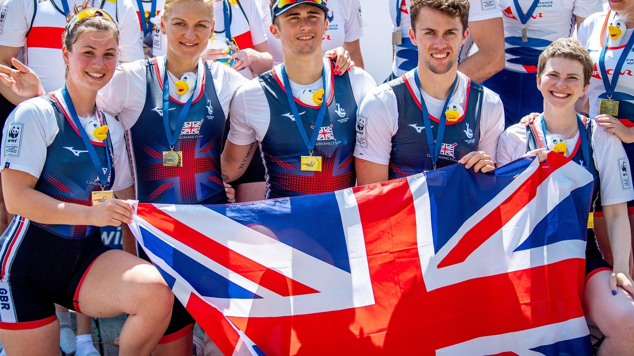 Erin Kennedy with the British PR3 mixed coxed fours on the podium after winning gold at the European Rowing Championships