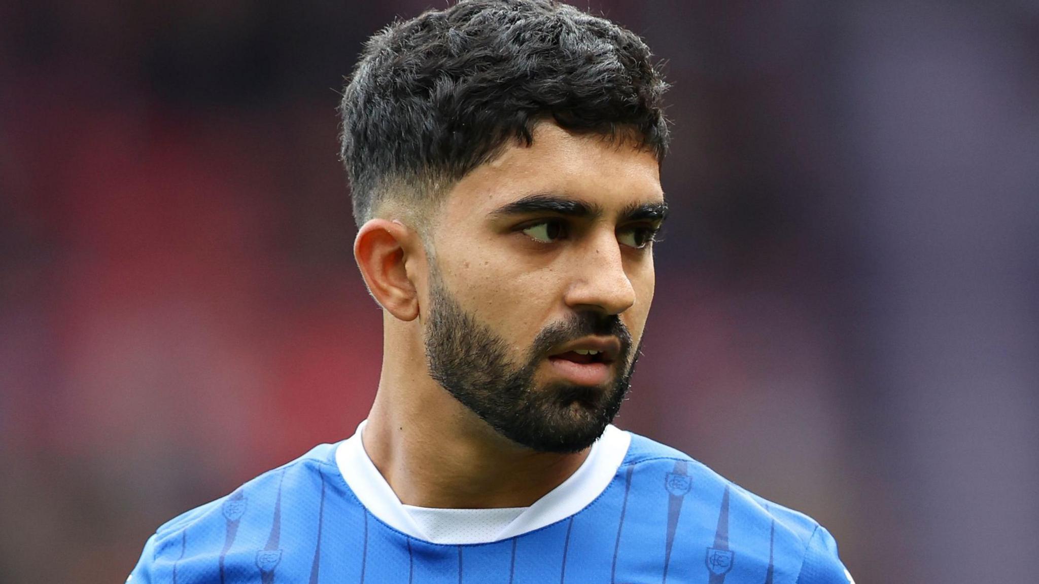 Dilan Markanday wearing a Chesterfield shirt