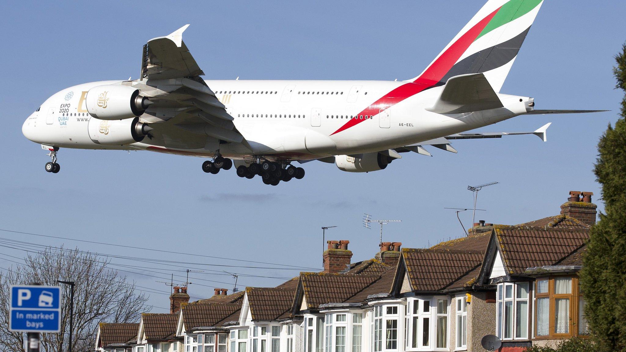 A380 coming in to land over residential housing