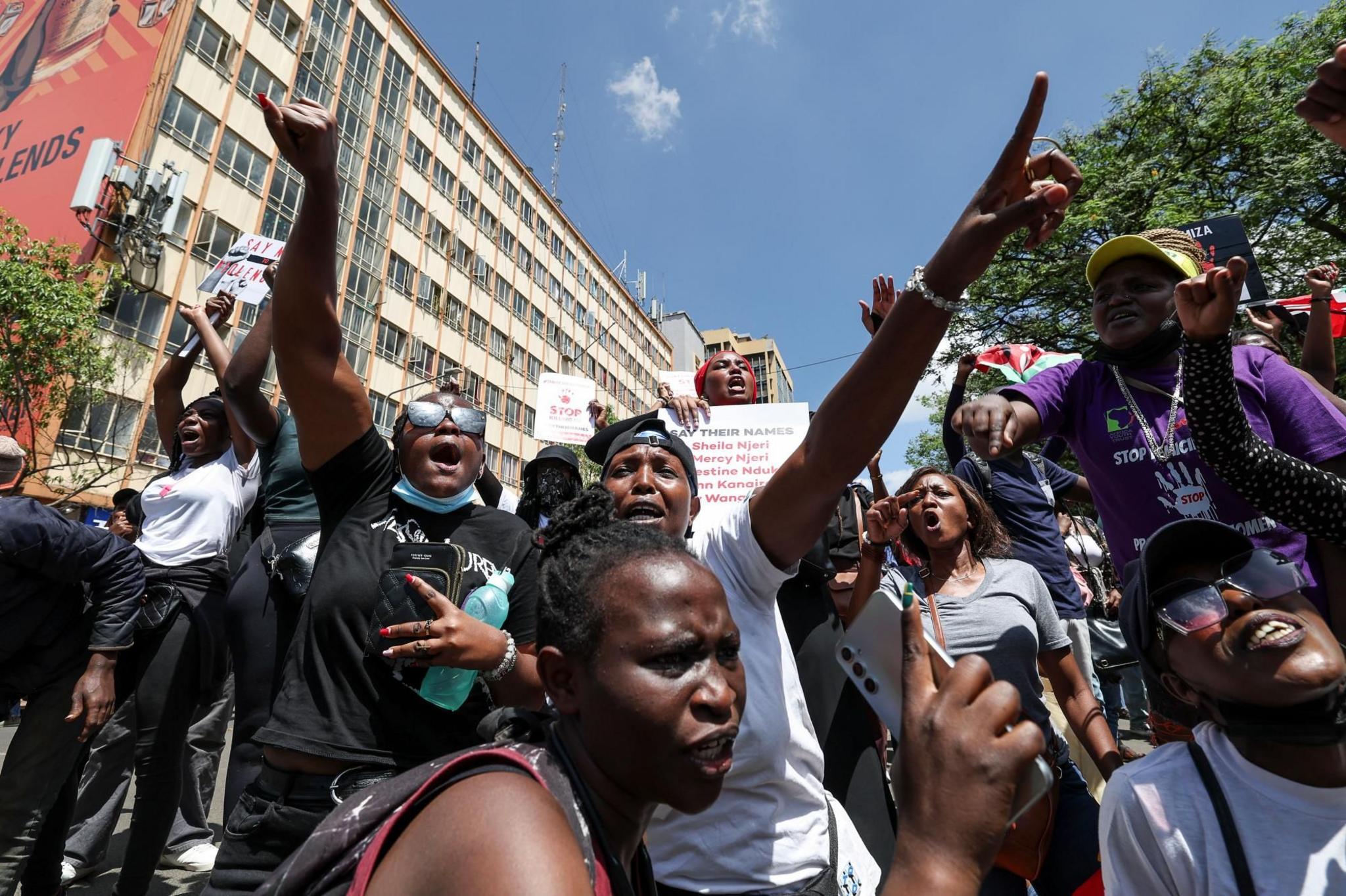 Kenyan activists shout slogans and hold placards on the streets of Nairobi, Kenya
