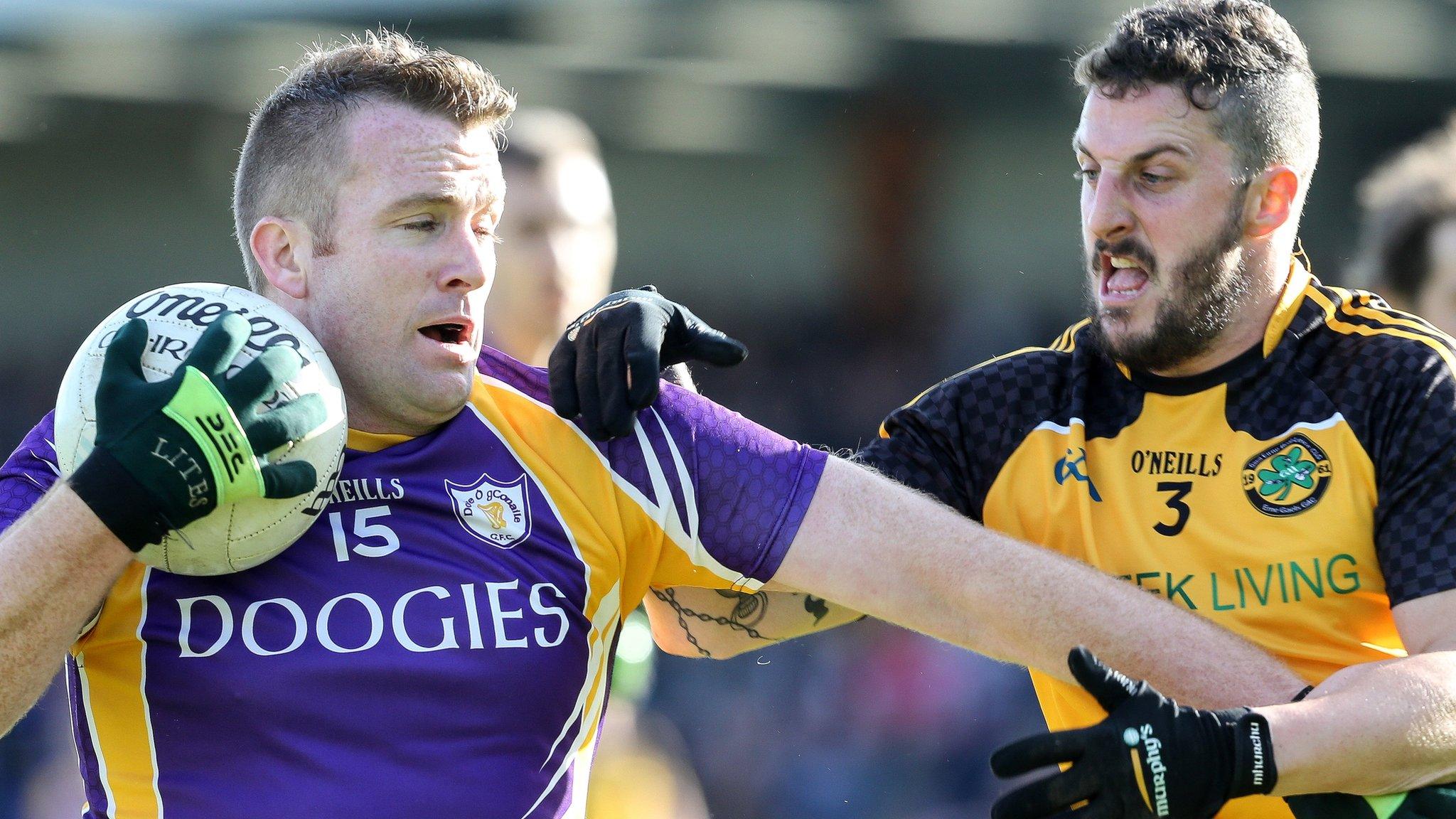 Derrygonnelly's Jonathan McGurn tussles with Erne Gaels defender Daniel McGullion