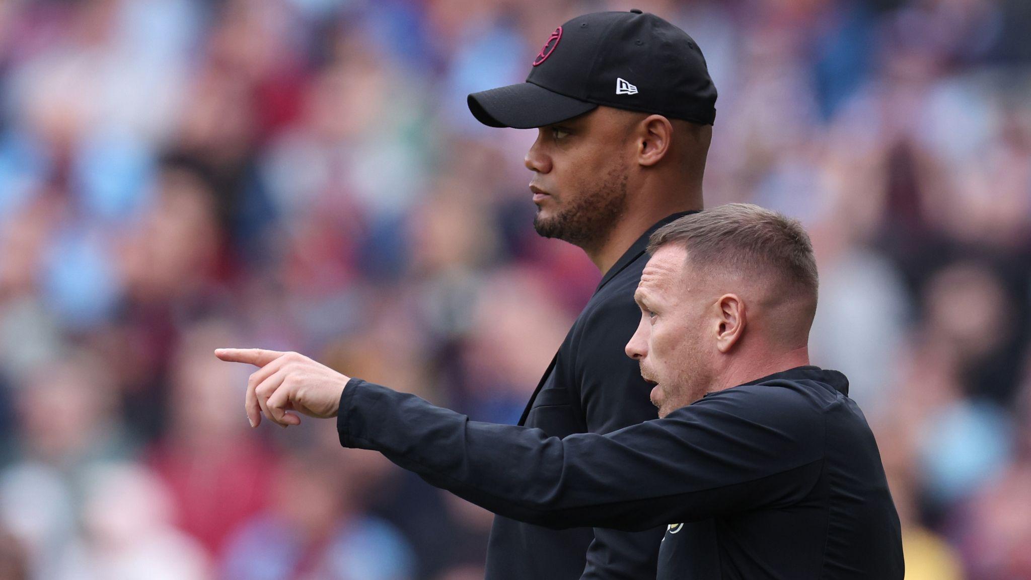 Vincent Kompany and Craig Bellamy on the touchline