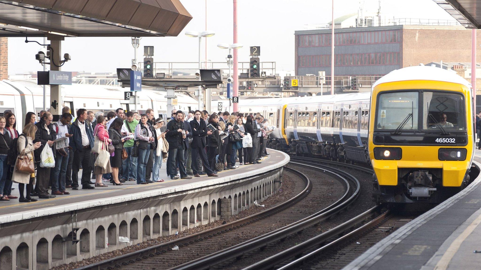 train pulling into crowded station