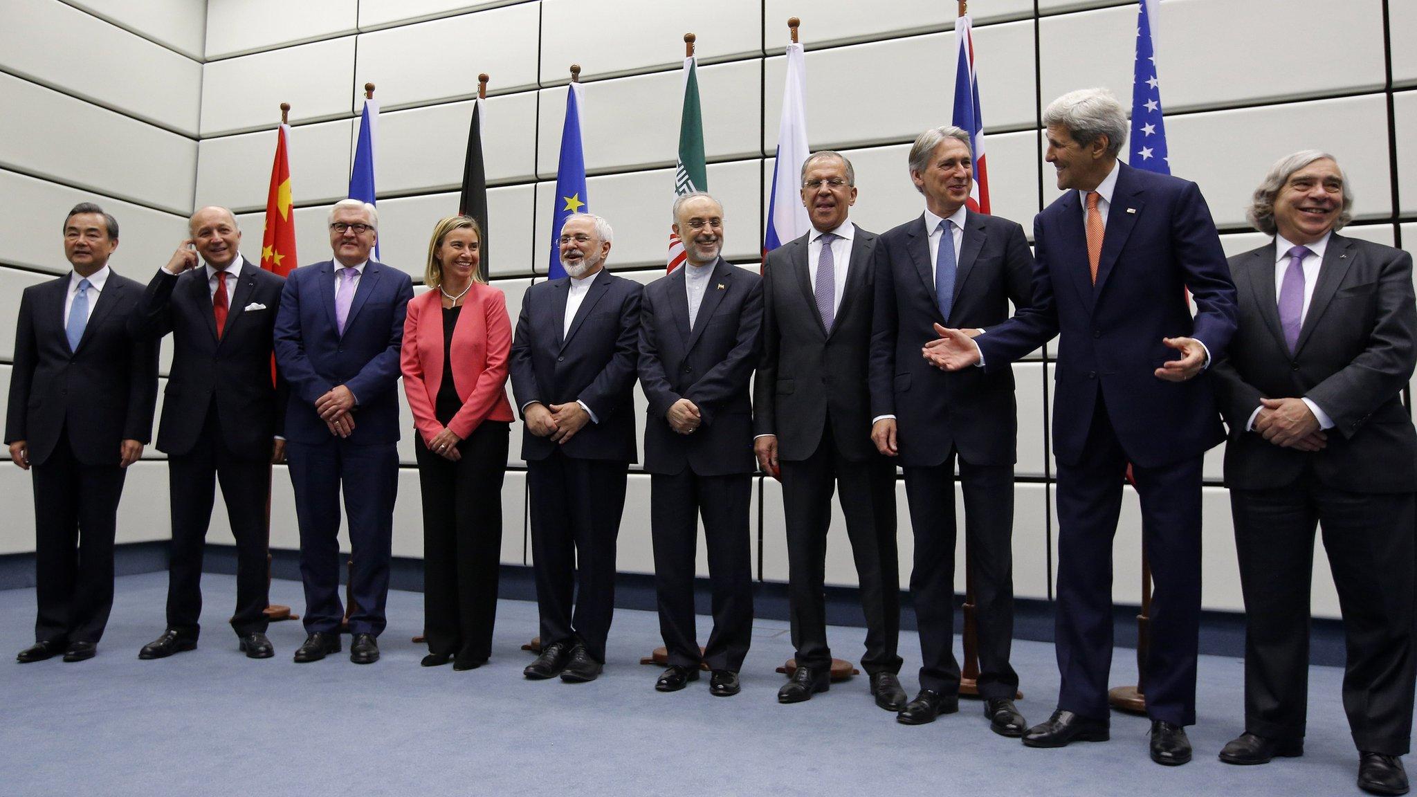 (From L to R) Chinese Foreign Minister Wang Yi, French Foreign Minister Laurent Fabius, German Foreign Minister Frank-Walter Steinmeier, European Union High Representative for Foreign Affairs and Security Policy Federica Mogherini, Iranian Foreign Minister Mohammad Javad Zarif, Head of the Iranian Atomic Energy Organization Ali Akbar Salehi, Russian Foreign Minister Sergei Lavrov, British Foreign Secretary Philip Hammond, US Secretary of State John Kerry and US Secretary of Energy Ernest Moniz pose for a group picture at the United Nations building in Vienna, Austria (14 July 2015)