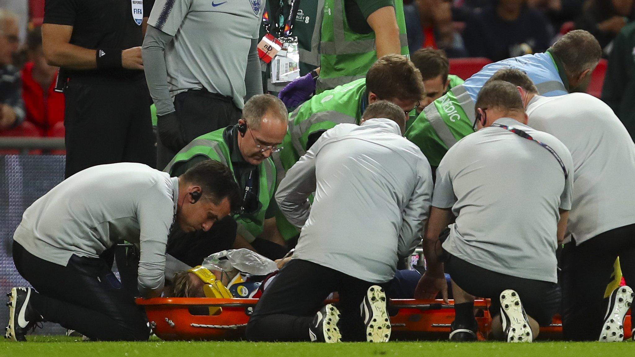 Luke Shaw receives treatment at Wembley