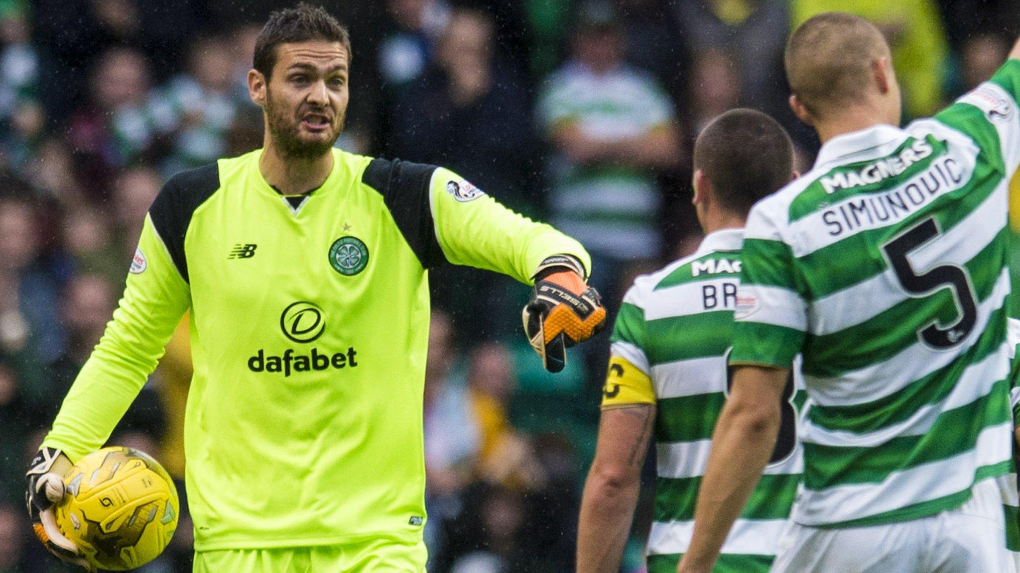 Craig Gordon makes a point to Celtic centre-back Jozo Simunovic