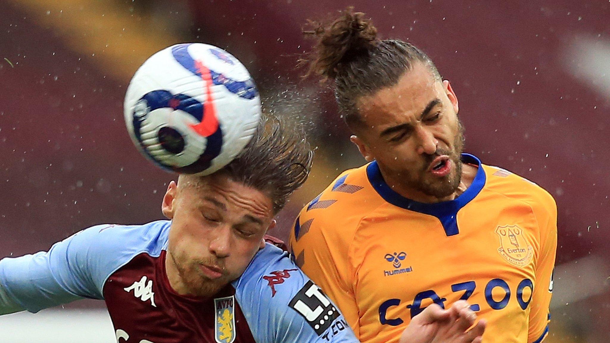 Aston Villa's Matty Cash competes with Everton's Dominic Calvert-Lewin