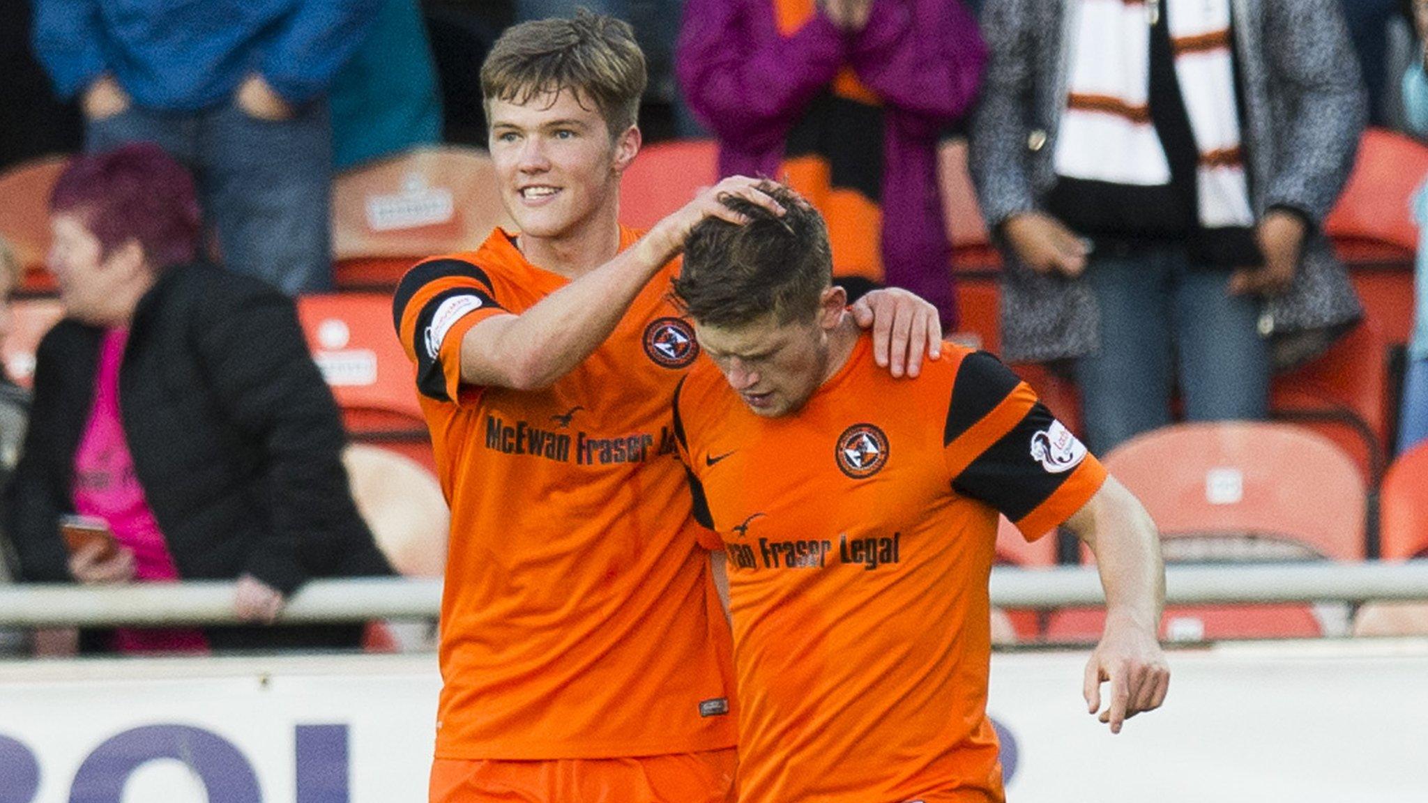 Blair Spittal congratulates Cammy Smith on his hat-trick goal