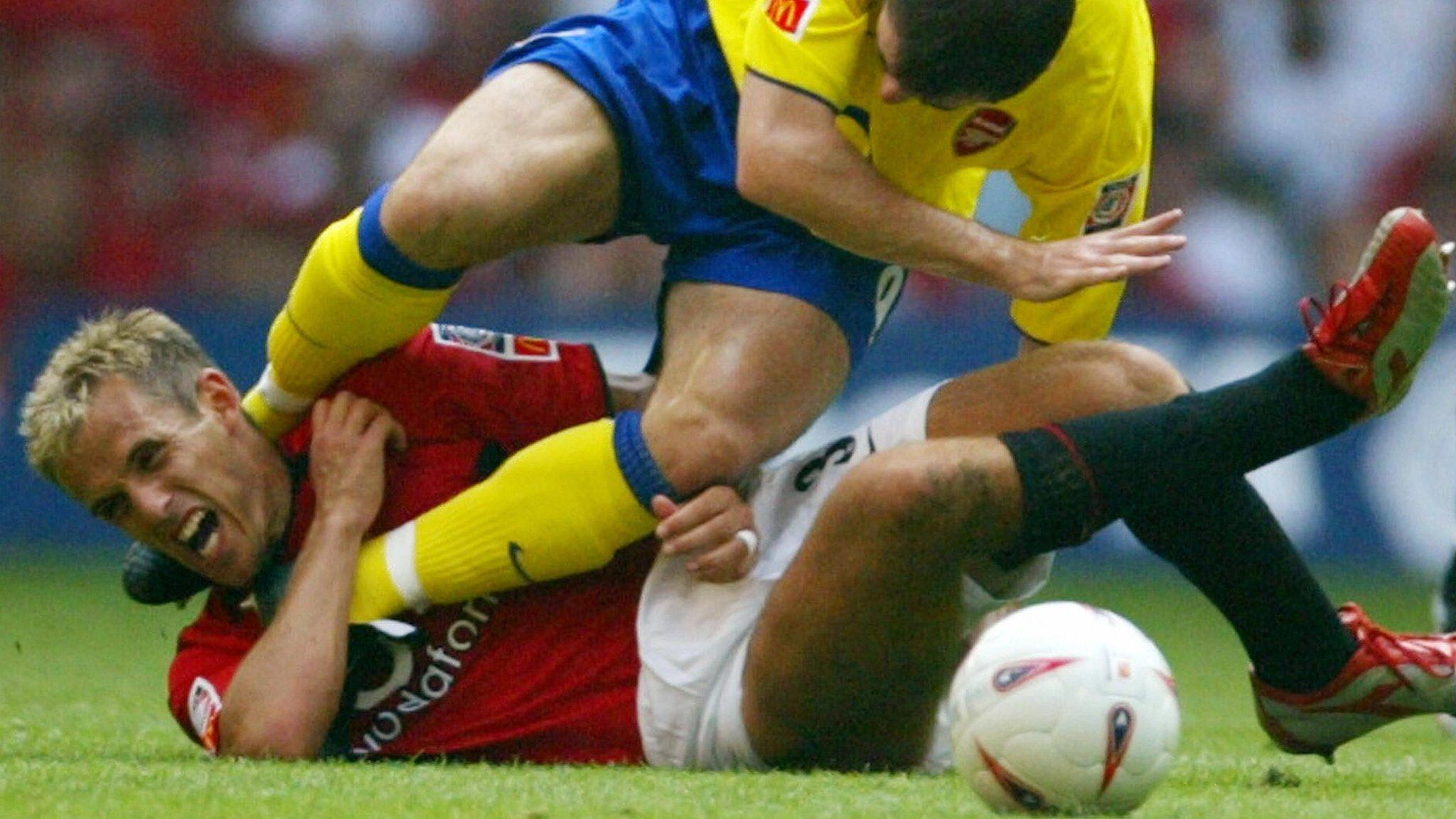 Phil Neville and Francis Jeffers tangle in the 2003 Community Shield