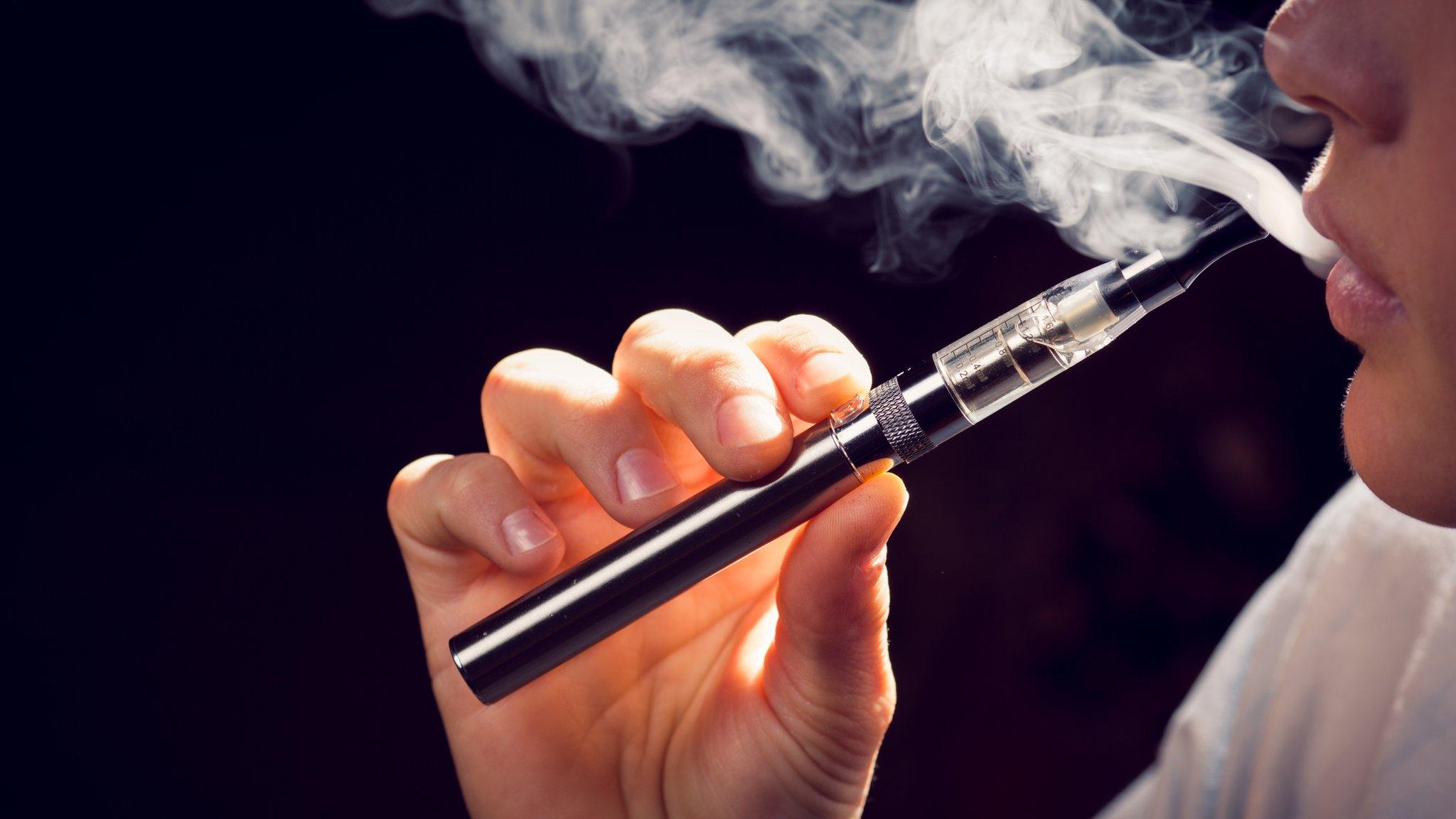 a person using an e-cigarette.