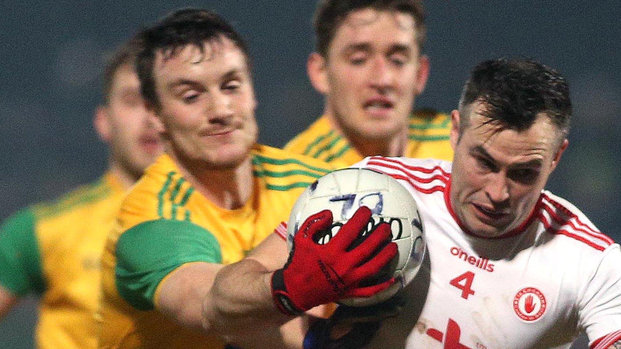 Donegal's Leo McLoone battles with Tyrone's Cathal McCarron at Healy Park