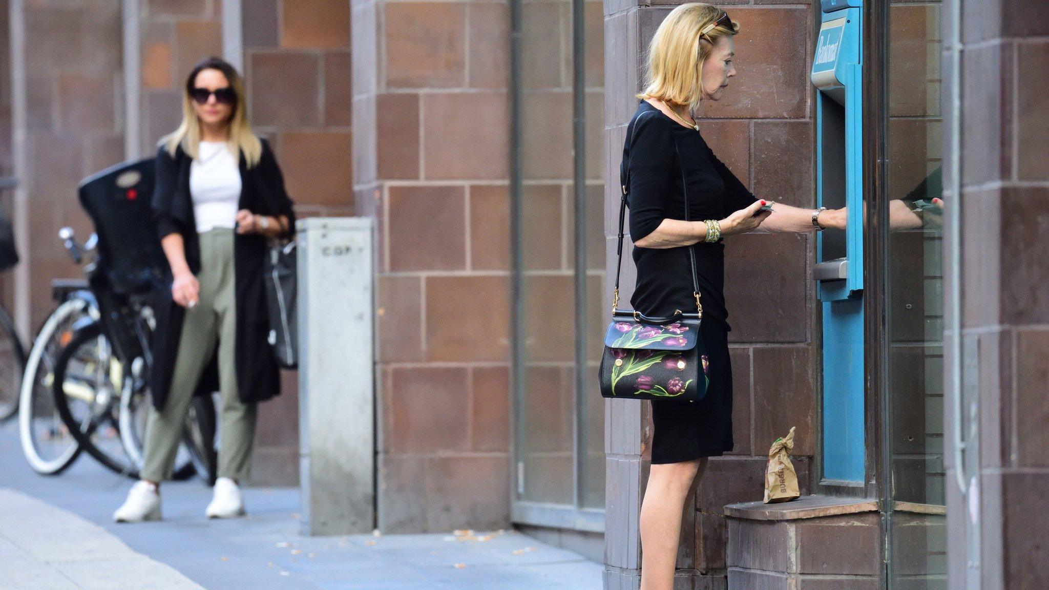 Woman at cash machine