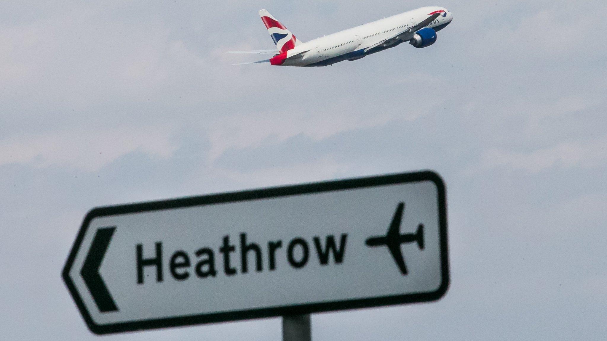 A Heathrow sign and an aeroplane