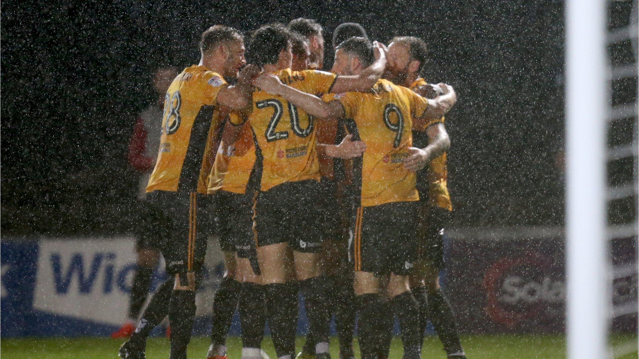 Newport striker Padraig Amond is congratulated