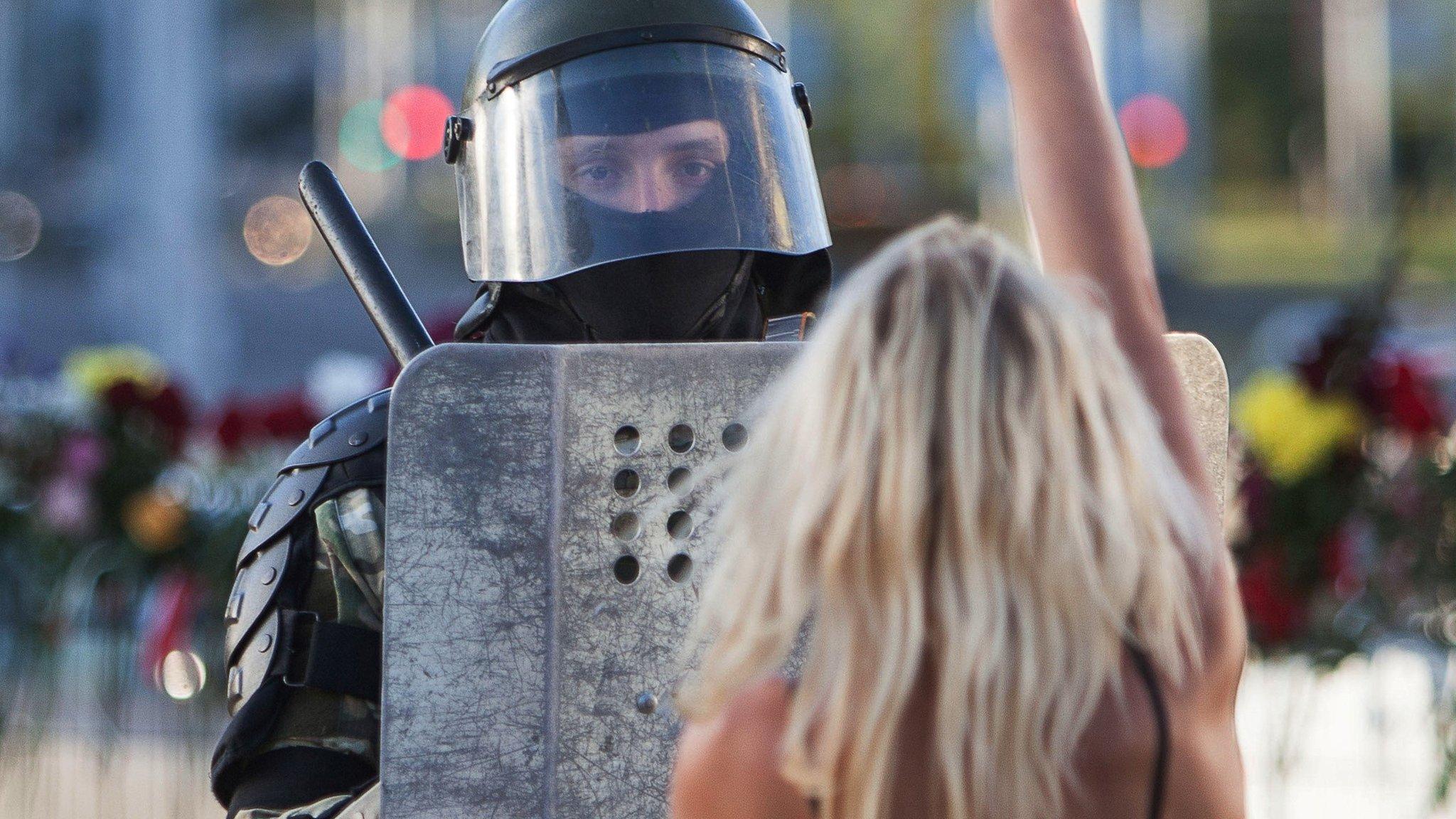 protester and police officer, 11 Aug