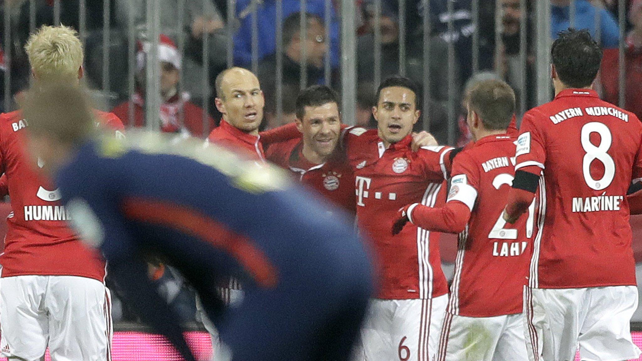 Bayern players celebrate Xabi Alonso's goal