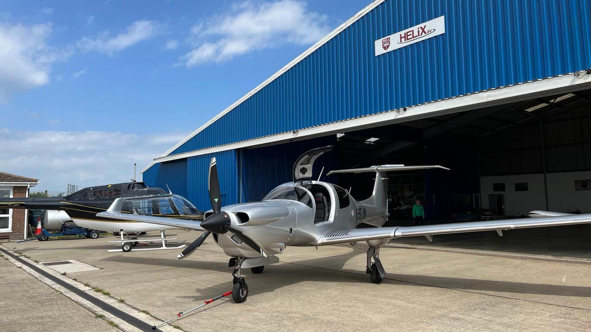 A small aircraft outside a hanger at Manston
