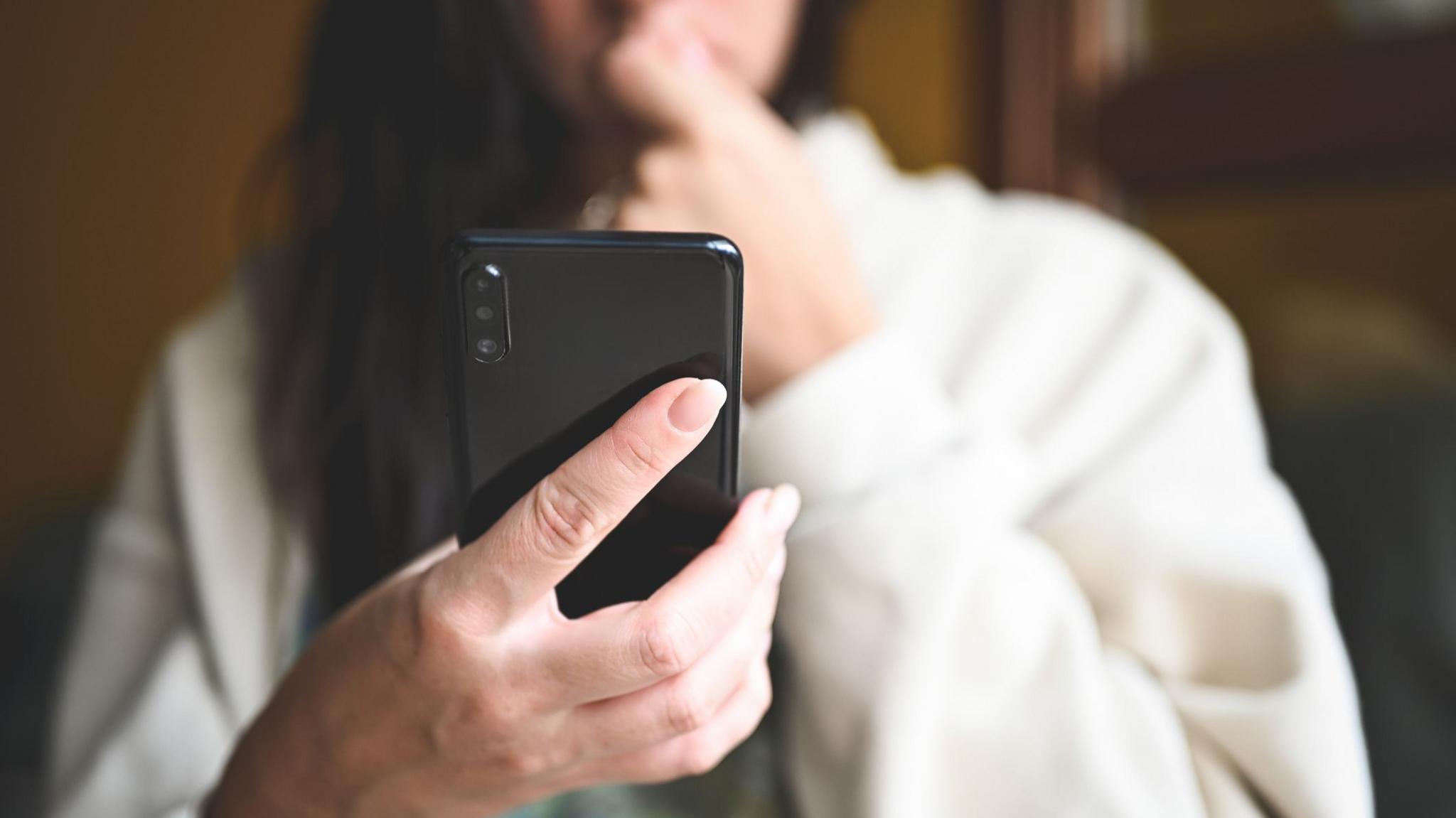 Woman looking at mobile phone