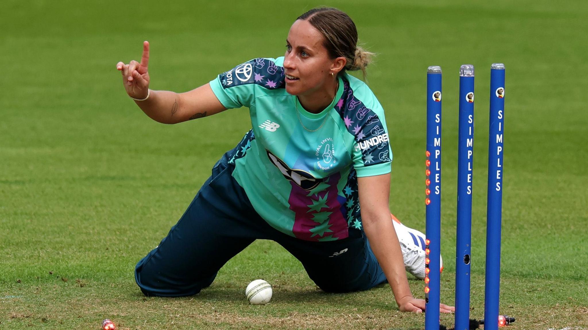 Tash Farrant, with raised right index finger' appeals for a dismissal while playing for Oval Invincibles in The Hundred