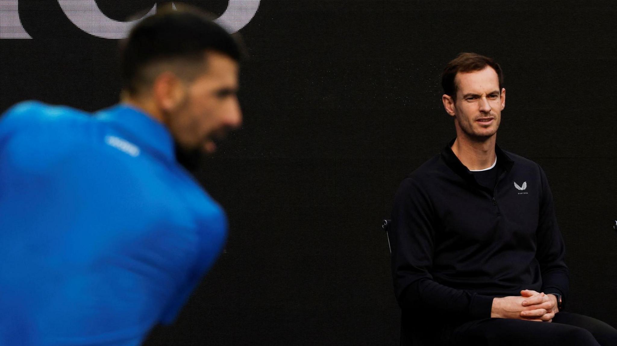 Andy Murray watches Novak Djokovic practise at the Australian Open in Melbourne