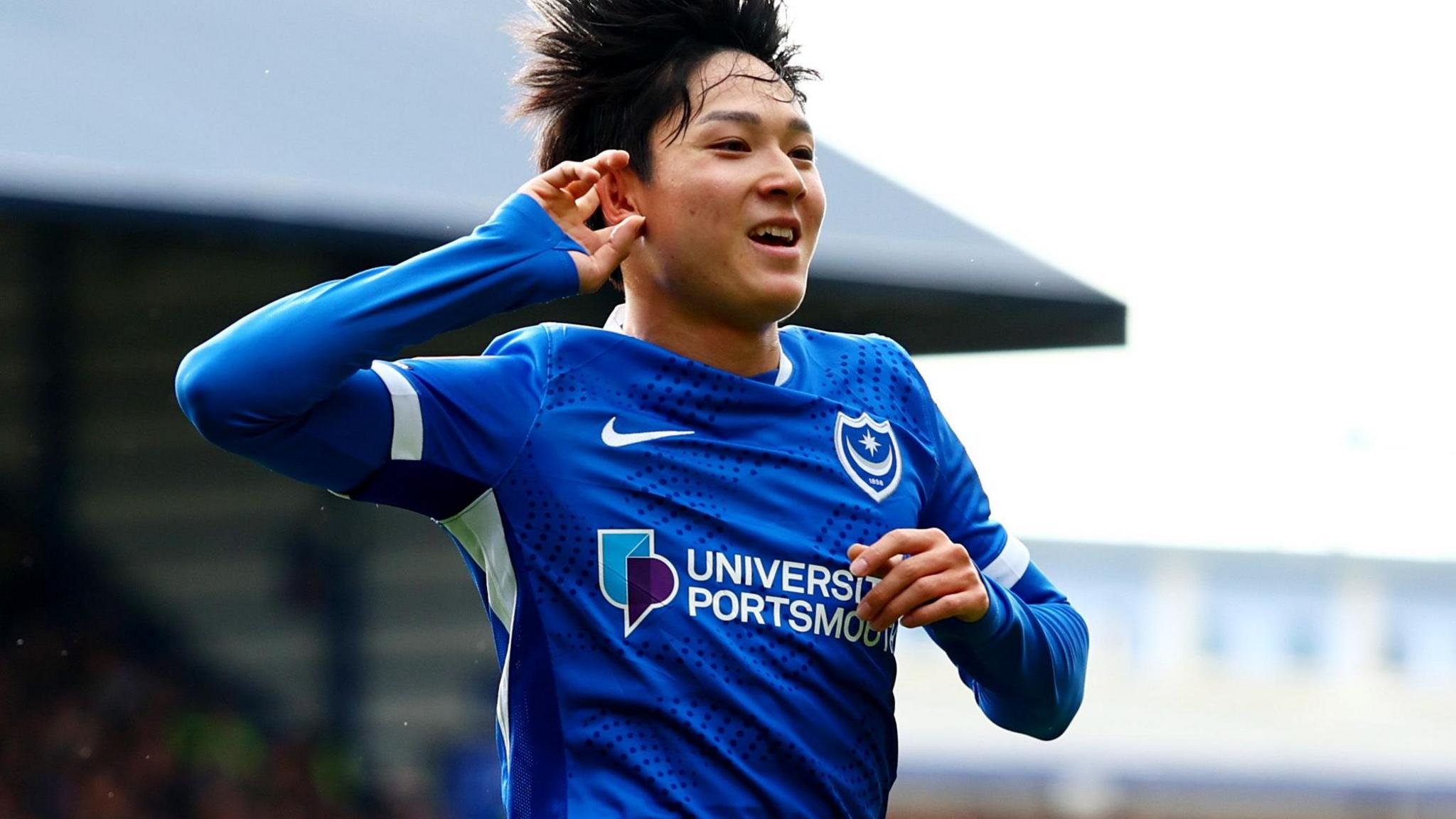Yang Min-hyeok celebrates scoring for Portsmouth