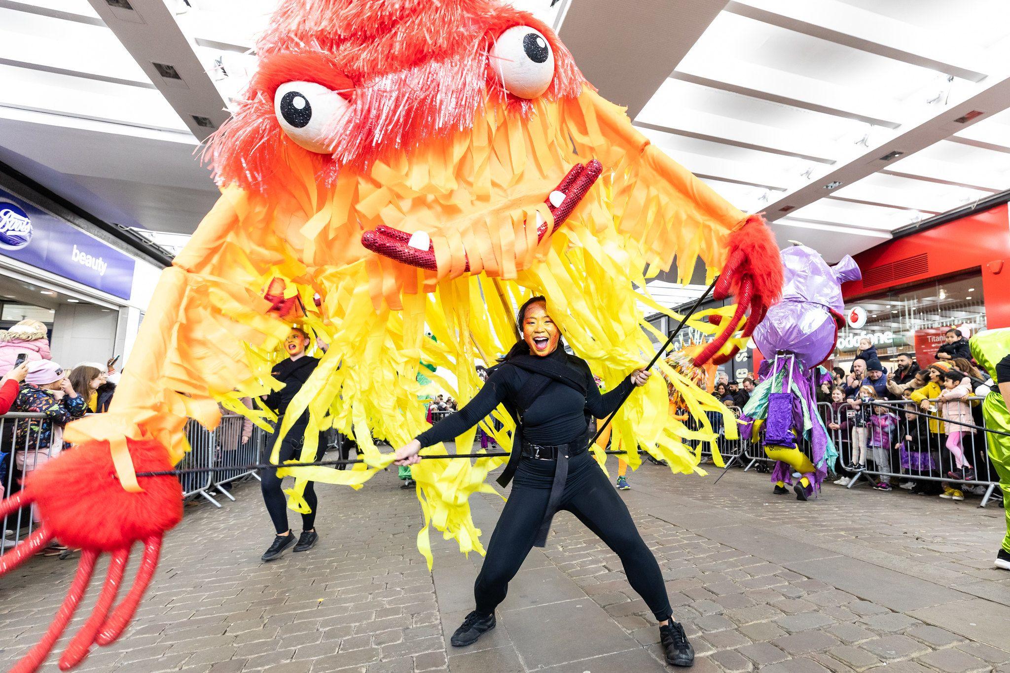 A giant yellow and red monster with bulging eyes hits the streets in Manchester 