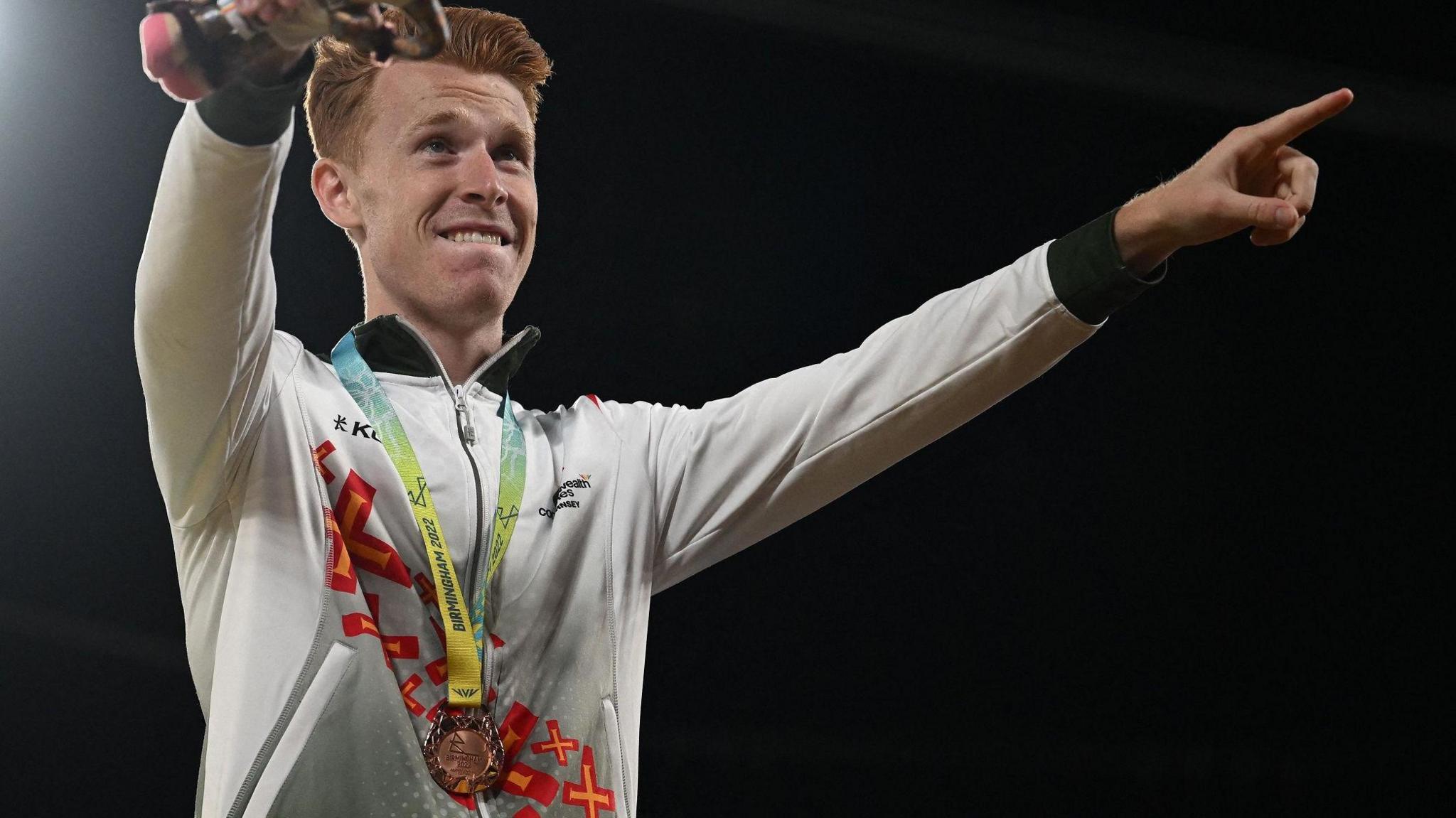 Alastair Chalmers shows off his bronze medal 