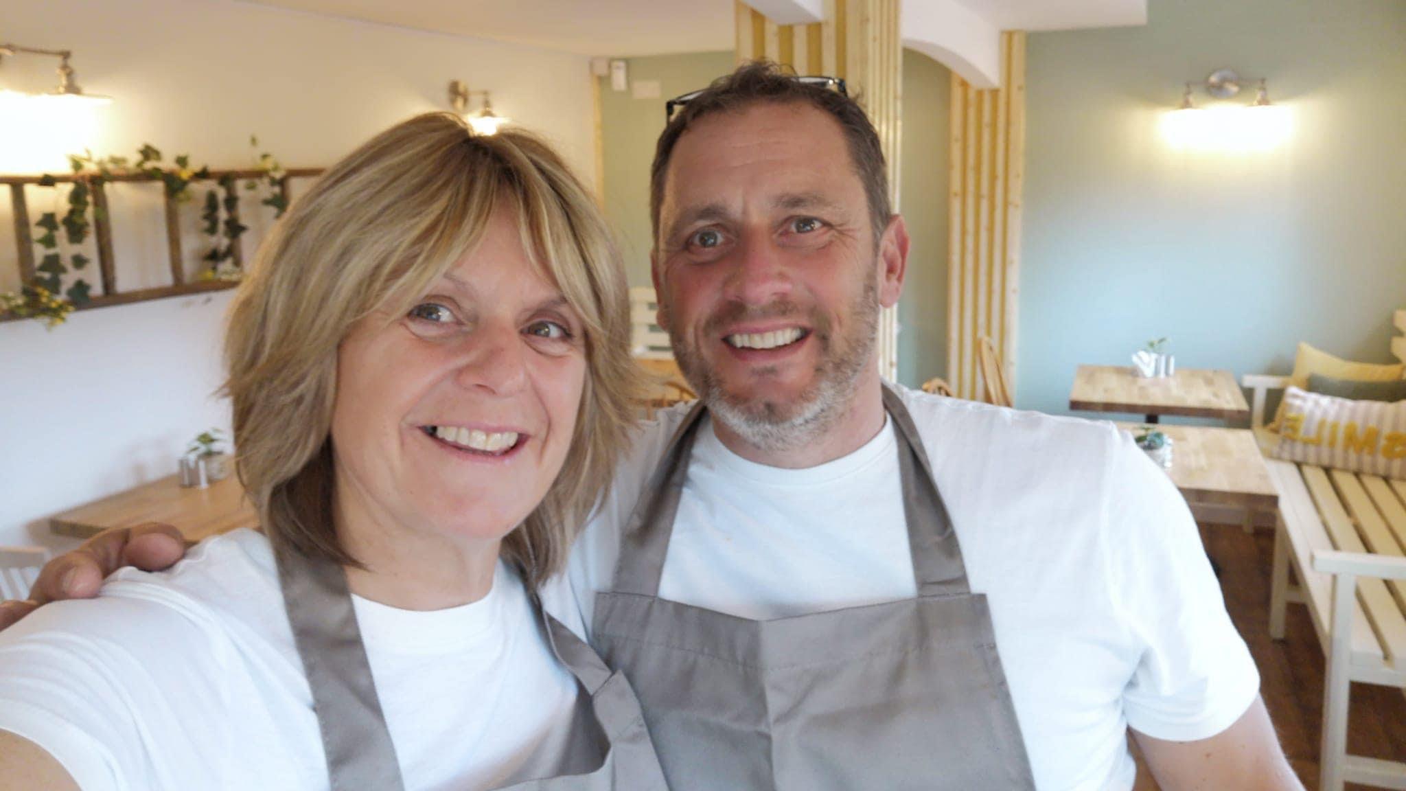 A selfie of Dawn and Andy Bailey in the cafe they run in Chaddesden Park