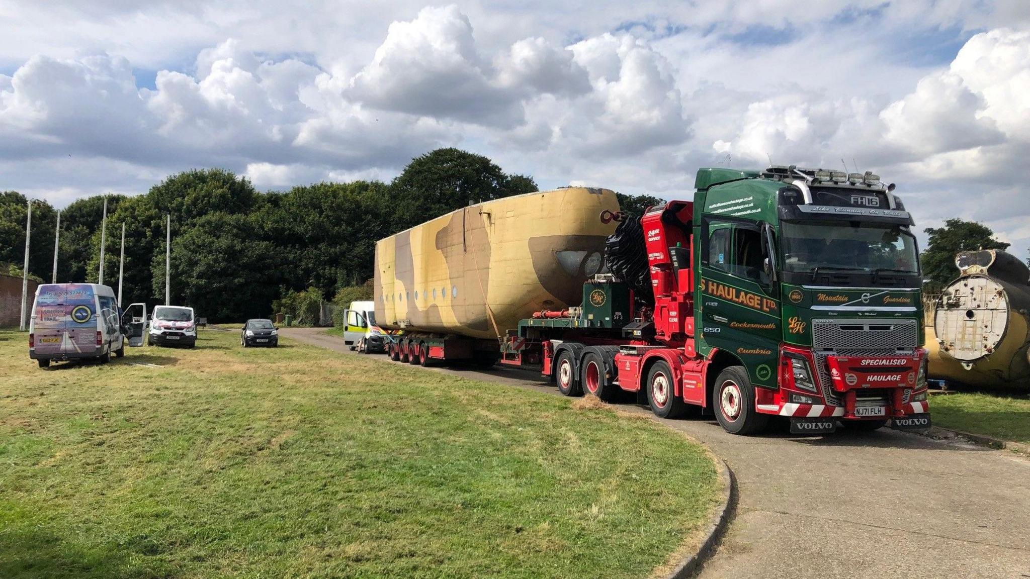 A lorry pulling away from Fort Paull in Hull carrying a section of Big Bev's fuselage