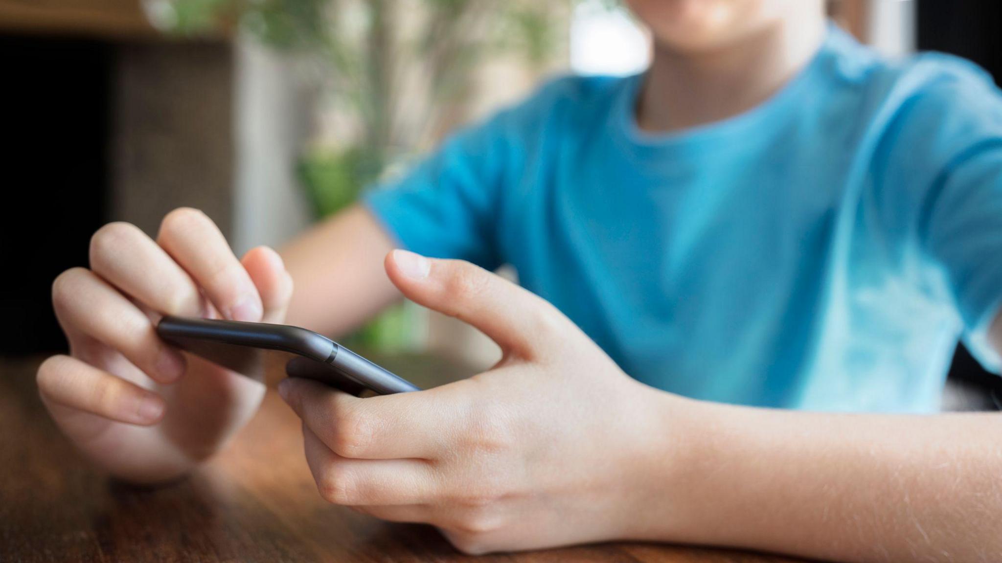 Young boy on phone 