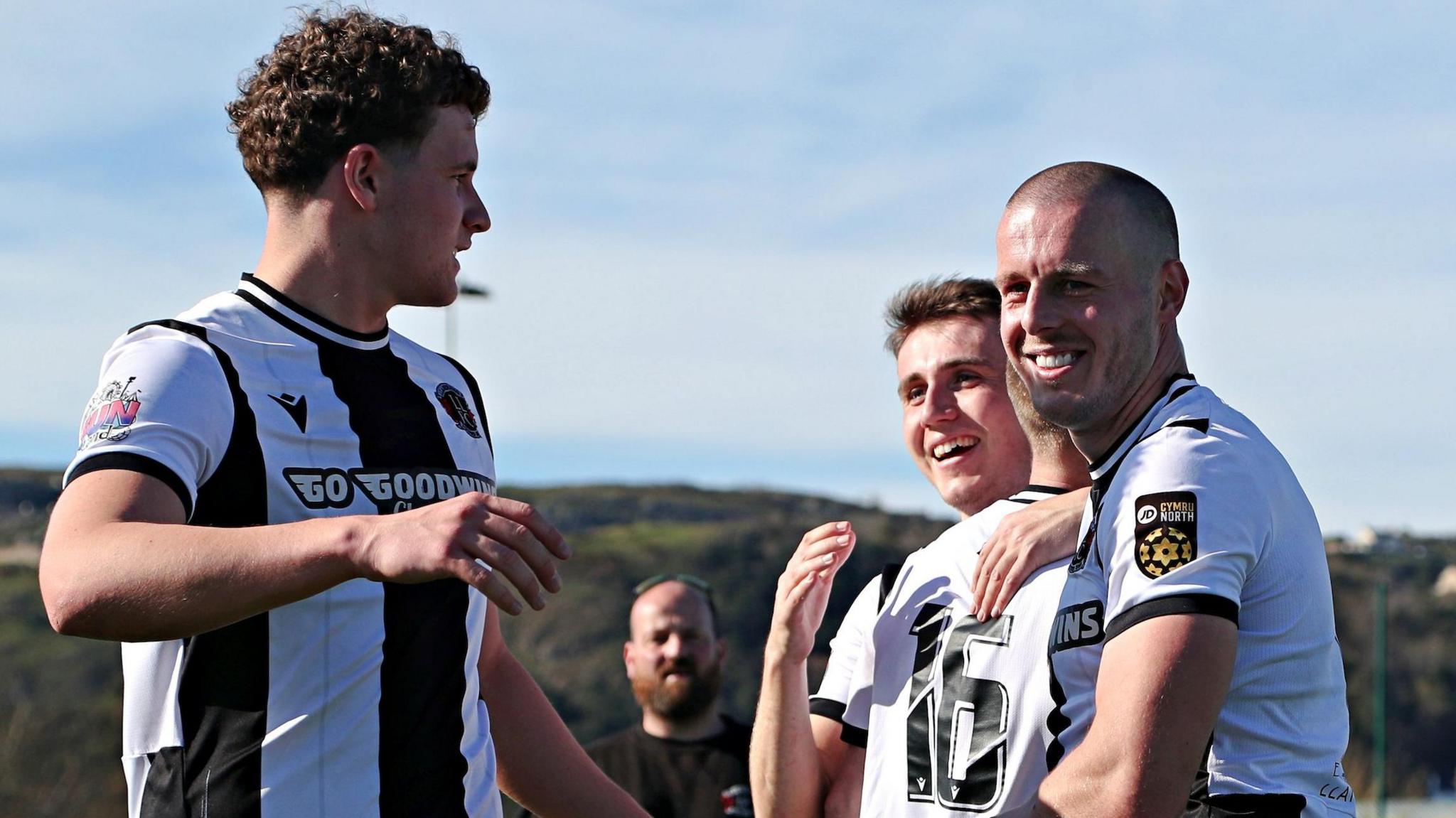 Llandudno players celebrate after securing the JD Cymru Premier title