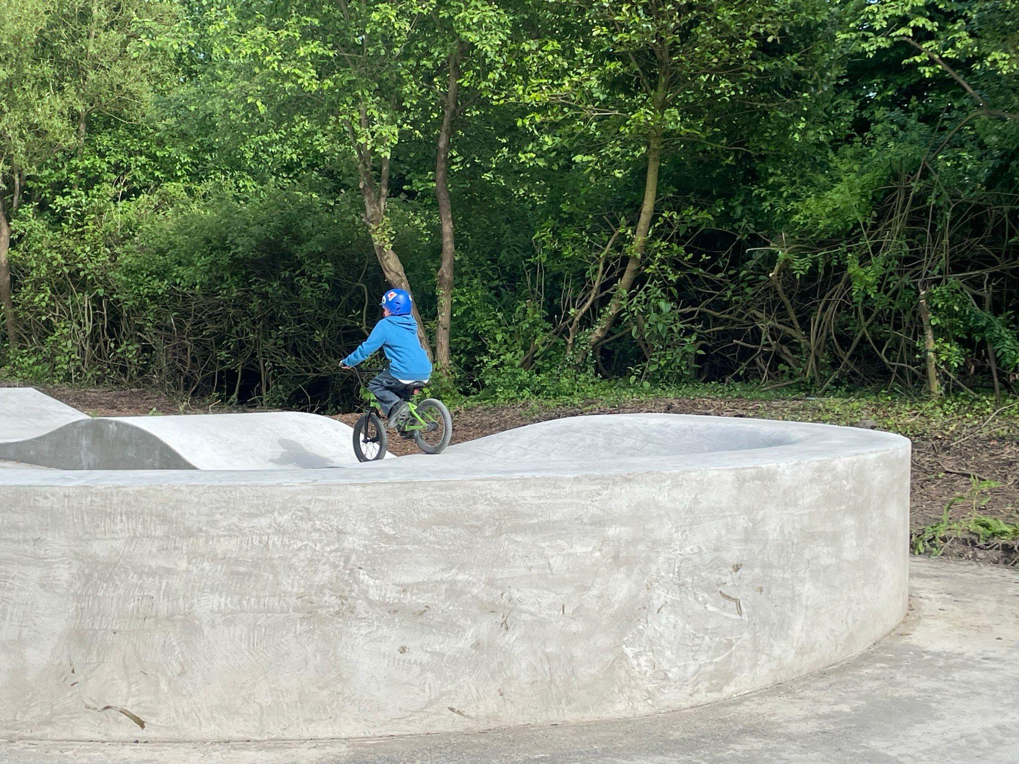 Child biking on skatepark