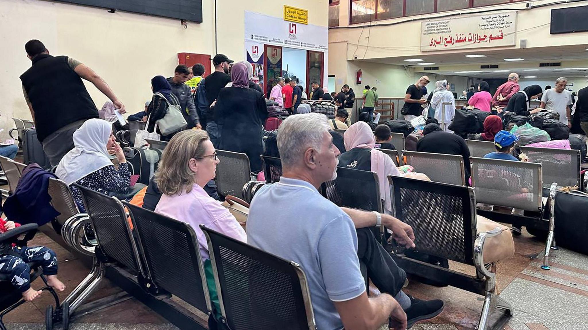 Foreign nationals exiting Gaza at Rafah crossing