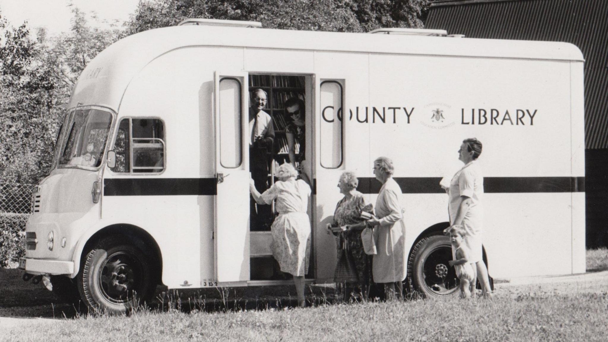 Women outside a library van