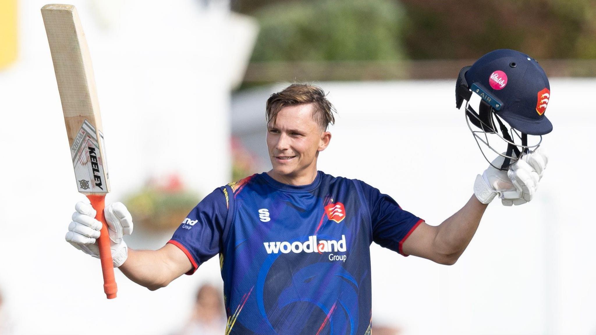 Essex's Michael Pepper holding his bat aloft