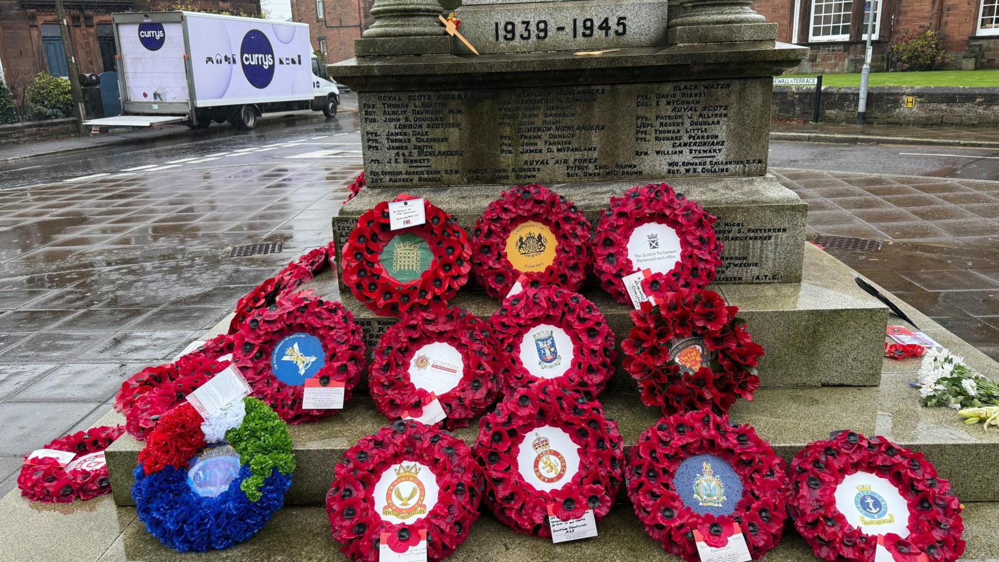 Memorial wreaths set at the war memorial in Dumfries showcasing various different tributes.