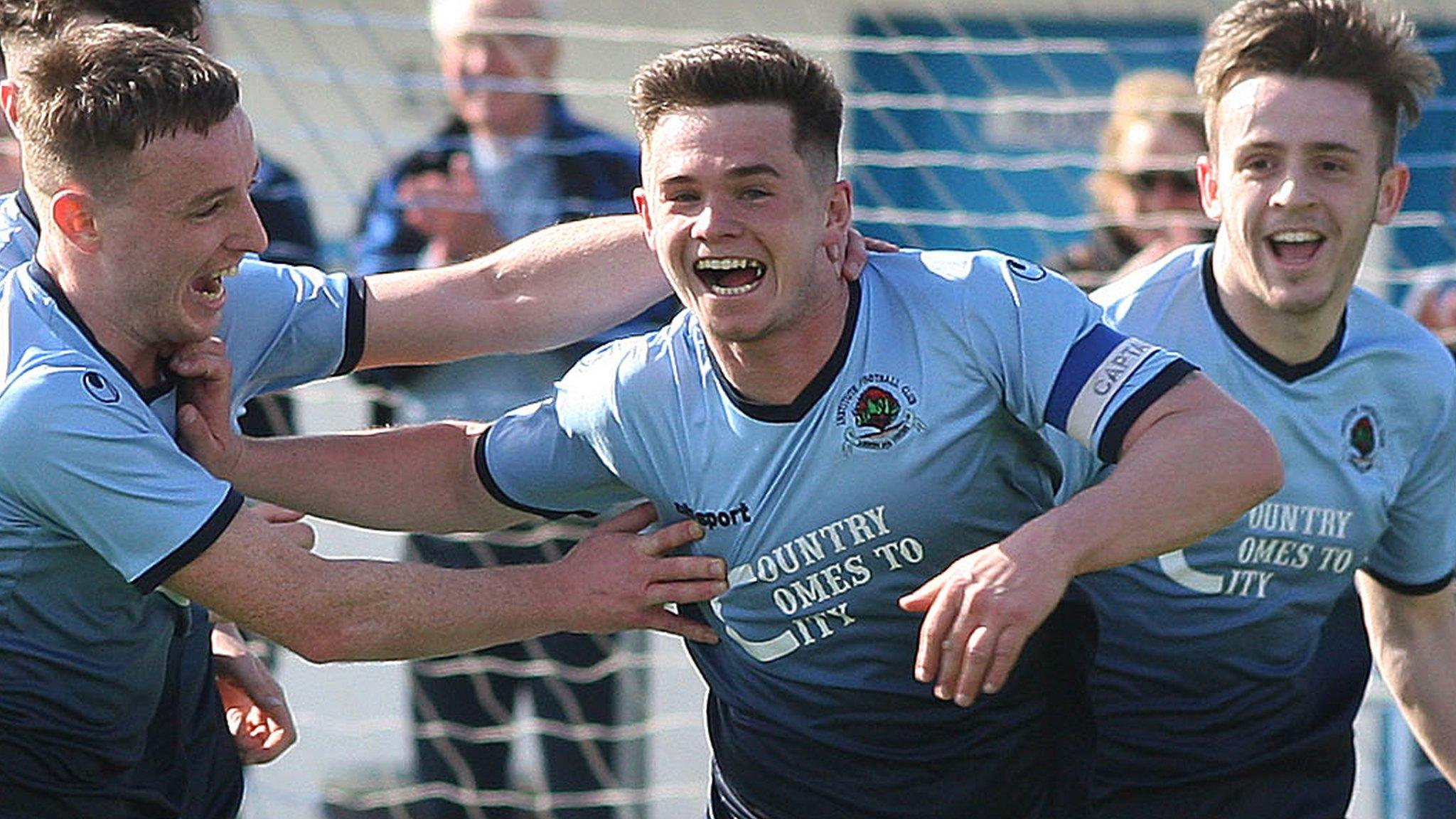 Institute striker Michael McCrudden celebrates scoring a goal