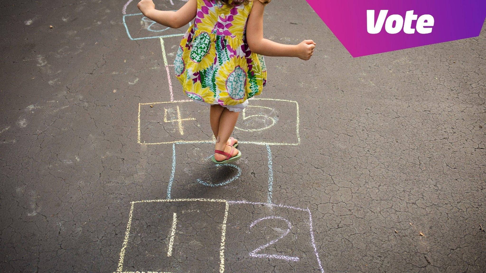 child playing hopscotch